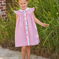 Little English traditional children's clothing. Classic dress for toddler girls in red windowpane with peter pan collar and tulip embroidery