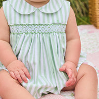 Little English traditional children's clothing. Classic sleeveless smocked peter pan bubble with soft green and white stripes for baby boys