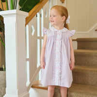 Little English traditional children's clothing. Classic dress for toddler girls in lavender stripe seersucker with peter pan collar and ballet slipper embroidery