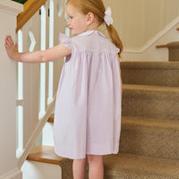 Little English traditional children's clothing. Classic dress for toddler girls in lavender stripe seersucker with peter pan collar and ballet slipper embroidery