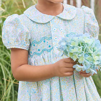 Little English traditional children's clothing. Capped sleeve peter pan dress for little girls in aqua, green, and yellow florals