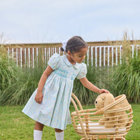 Little English traditional children's clothing. Capped sleeve peter pan dress for little girls in aqua, green, and yellow florals