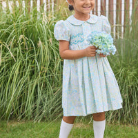 Little English traditional children's clothing. Capped sleeve peter pan dress for little girls in aqua, green, and yellow florals