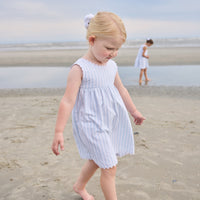 Little English traditional children's clothing. Light blue and white striped sleeveless dress with white ricrac trim for little girls