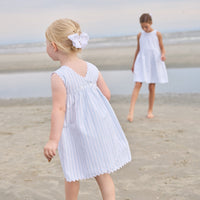 Little English traditional children's clothing. Light blue and white striped sleeveless dress with white ricrac trim for little girls