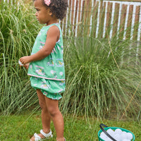 Little English traditional children's clothing. Green and pink two piece set with golf cart print for baby girls.