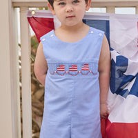 Little English traditional children's clothing. Classic john john for toddler boys in royal blue mini gingham with American flag smocking at the chest