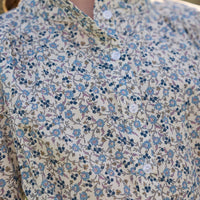 Little English traditional children's clothing. Long sleeve blue, brown, and cream floral shirt dress with tie sash for older girls.