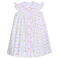 Little English traditional children's clothing. Pink and green Meriwether Floral dress for little girls with white peter pan collar and placket with pink floral embroidery.