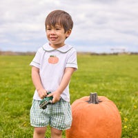 Little English classic short set for little boys. White knit peter pan shirt with applique pumpkin at the center and coordinating banded shorts in green Leland Plaid.