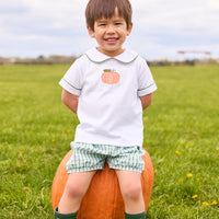 Little English classic short set for little boys. White knit peter pan shirt with applique pumpkin at the center and coordinating banded shorts in green Leland Plaid.