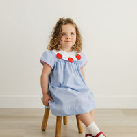 Little English traditional children's clothing. Short sleeve royal blue gingham dress with white bib collar with applique apples for little girls