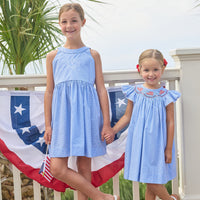 Little English traditional children's clothing. Royal blue mini gingham sleeveless dress with white ricrac trim and bow tie in back for little girls