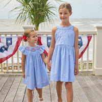 Little English traditional children's clothing. Royal blue mini gingham sleeveless dress with white ricrac trim and bow tie in back for little girls