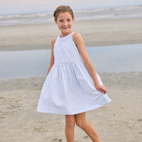 Little English traditional children's clothing. Light blue and white Savannah Stripe sleeveless dress with white bow tie in back for little girls