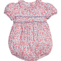 Little English traditional children's clothing. Soft blue and raspberry red Lennox Floral short sleeve bubble for baby girls with ruffle collar and blue piping detail at sleeves and chest