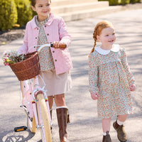 Little english classic childrens clothing, quilted jacket in light pink, hallie top in orange, blue, and green james floral, paperbag bow skirt in stone corduroy, evelyn dress in james floral, coordinating fall outfits for sisters