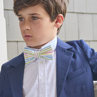 Little English traditional children's clothing. Rainbow stripe seersucker bow tie for boys.