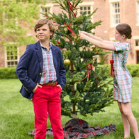 Little English classic children's clothing. Girls A-line dress in red and green plaid with red bow and red piping detail for the holidays