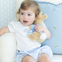 Little English traditional children's clothing. Toddler girl's white short-sleeve peter pan blouse with crochet blue bow for Spring