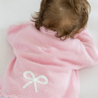 Pink Crochet cardigan for baby girl with white bow motif, Little English classic baby girl's sweater