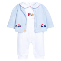 Little English traditional children's clothing. Light blue cotton cardigan with crocheted holiday trains on either side and in back for baby boys. Layered over white pima cotton playsuit with red picot trim and holiday train crochet at the center chest