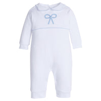 Little English traditional children's clothing. Baby girl's white knit peter pan playsuit romper with blue bow crochet for Spring. Gift clothing for baby girl