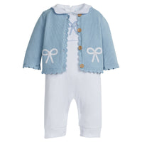 Little English traditional children's clothing. Baby girl's white knit peter pan playsuit romper with blue bow crochet for Spring. Gift clothing for baby girl