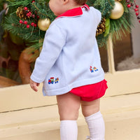 Little English classic children's clothing. Red corduroy bubble with white contrast piping for baby boys for the holidays. Paired with light blue cardigan with holiday train embroidery