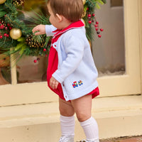 Little English classic children's clothing. Red corduroy bubble with white contrast piping for baby boys for the holidays. Paired with light blue cardigan with holiday train embroidery