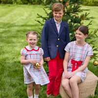 Little English classic children's clothing. Girls A-line Cora Dress in red and green plaid with red bow and red piping detail for the holidays. Boys Douglas Plaid button down shirt with red corduroy pants and navy wool blazer. Toddler girls Eleanor Dress - Douglas Plaid with ruffled peter pan collar and tie sash in back.