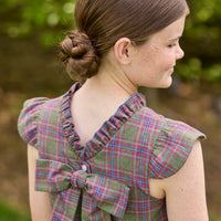 Little English traditional children's clothing. Olive and maroon Thornhill Plaid column dress with capped sleeves, ruffled neckline, and fixed bow in back for older girls for the holidays
