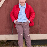 Little English traditional children's clothing. Classic long sleeve light blue polo and chocolate brown corduroy pants with seated lab embroidery for boys. Layered with red quilted jacket with corduroy details.