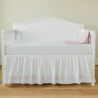 Little English classic nursery goods for baby, white crib skirt with simple light pink embroidery along the edges for baby