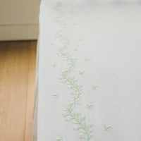 Little English classic nursery goods for baby, white crib sheet with simple light green embroidery along the edges for baby