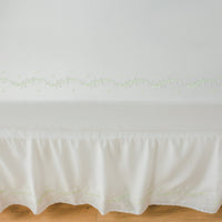 Little English classic nursery goods for baby, white crib sheet with simple light green embroidery along the edges for baby