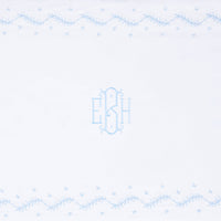 Little English classic nursery goods for baby, white crib sheet with simple light blue embroidery along the edges for baby