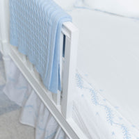 Little English classic nursery goods for baby, white crib sheet with simple light blue embroidery along the edges for baby