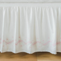 Little English classic nursery goods for baby, white crib skirt with simple light pink embroidery along the edges for baby