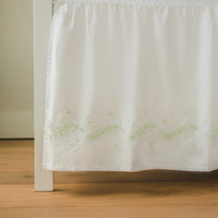 Little English classic nursery goods for baby, white crib skirt with simple light green embroidery along the edges for baby