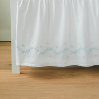 Little English classic nursery goods for baby, white crib skirt with simple light blue embroidery along the edges for baby