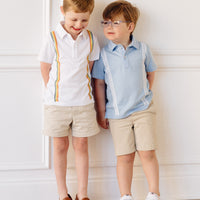Little English x Mi Golondrina white cotton polo for spring, boy's short sleeve polo with multicolored embroidery
