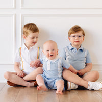 Little English x Mi Golondrina blue cotton polo for spring, boy's short sleeve polo with white embroidery
