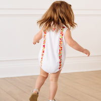 Little English x Mi Golondrina white cotton bubble for spring, baby girl's sleeveless polo bubble with multicolored embroidery