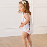 Little English x Mi Golondrina white cotton bubble for spring, baby girl's sleeveless polo bubble with multicolored embroidery