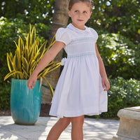 Little English traditional girl's clothing, classic smocked dress for toddler girls with peter pan collar and sash, little girl's flower girl dress with light blue smocking