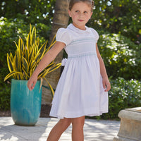 Little English traditional girl's clothing, classic smocked dress for toddler girls with peter pan collar and sash, little girl's flower girl dress with light blue smocking