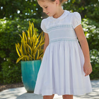 Little English traditional girl's clothing, classic smocked dress for toddler girls with peter pan collar and sash, little girl's flower girl dress with light blue smocking