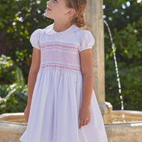 Little English traditional girl's clothing, classic smocked dress for toddler girls with peter pan collar and sash, little girl's flower girl dress with light pink smocking