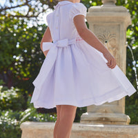 Little English traditional girl's clothing, classic smocked dress for toddler girls with peter pan collar and sash, little girl's flower girl dress with light pink smocking